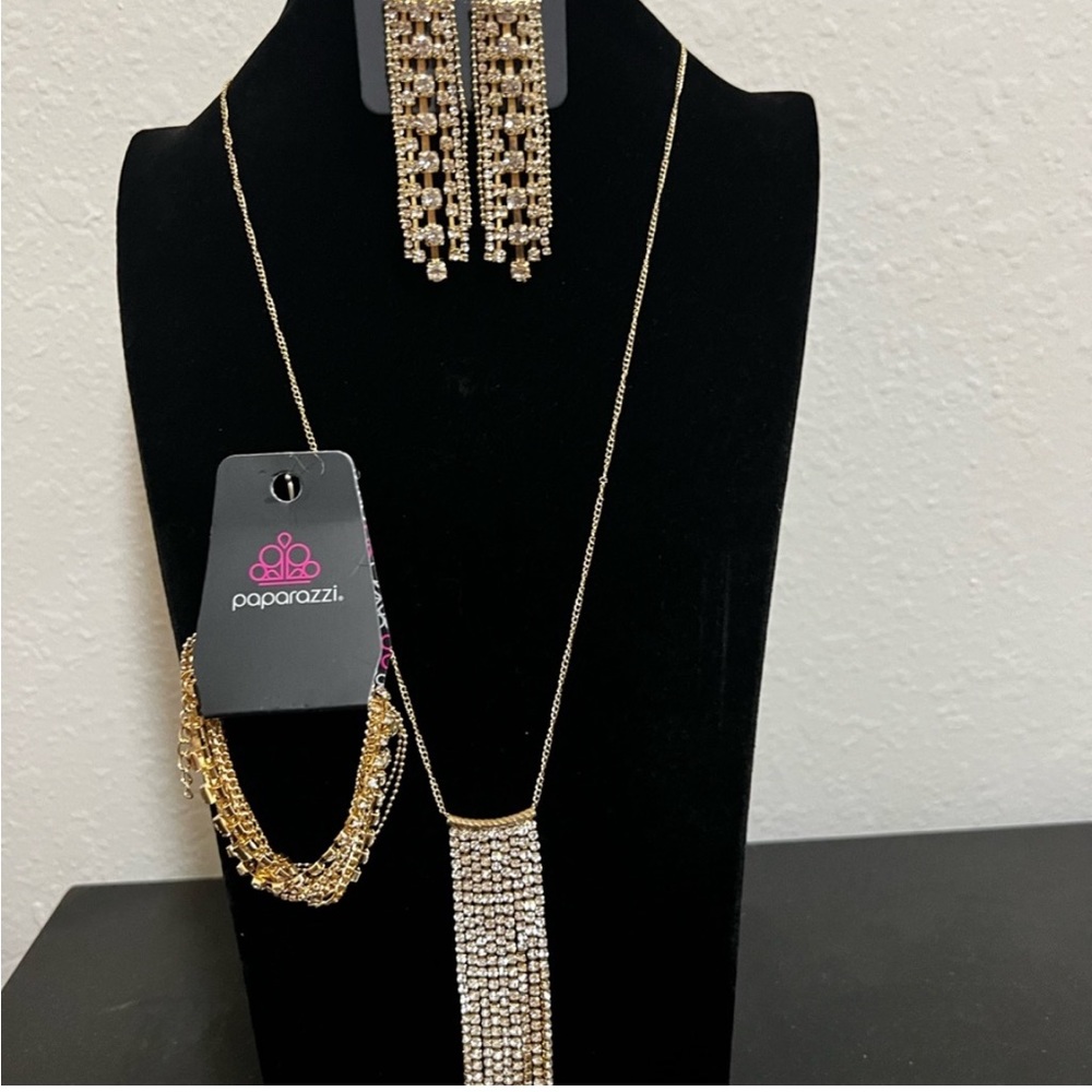 This is a three piece, gold and rhinestones set.